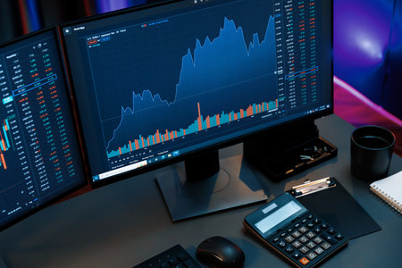 Big screens of dynamic stock market exchange graph showing on computer at neon light night time....