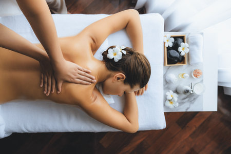 Panorama top view woman customer enjoying relaxing anti-stress spa massage and pampering with beauty skin recreation leisure in day light ambient salon spa at luxury resort or hotel. Quiescentの写真素材