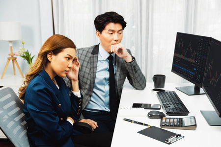Stressful exchange investing business partners discussing in loss profit stock exchange rate investment missing trade value dynamic complication on financial application in recession stage. Infobahn.の写真素材