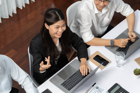Analyst team utilizing BI Fintech to analyze financial data at table in meeting room. Businesspeople analyzing BI dashboard power on paper for business insight and strategic marketing planning.Prudentの写真素材