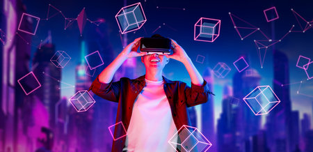 Smart man wearing VR glasses while excited about exploring in metaverse. Asian gamer looking at...
