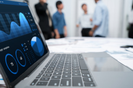 Analytic database by BI Fintech dashboard displayed on laptop for analyzed financial data on blur background with business people analyzing for insights power into business marketing planning.Prudentの写真素材