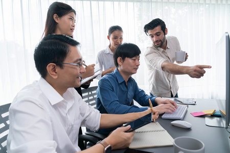 Group of diverse office worker employee working together on strategic business marketing planning in corporate office room. Positive teamwork in business workplace concept. Prudentの写真素材