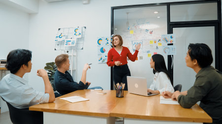 Young beautiful leader presents marketing strategy while expert investor and project manager...