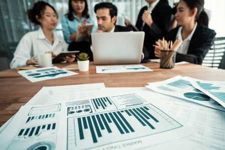 Piles of analyzed financial data dashboard on meeting table with background of business people analyzing data analysis market trend indication for strategic marketing investment plan. Habilimentの写真素材