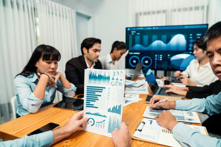 Diverse group of business analyst team analyzing financial data report. Finance data analysis chart...