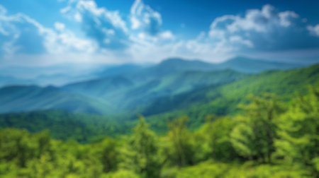 Blur background of spring nature with park or grass lawn with sun ray in summer. Landscape of grass field, cloud and blue sky in bright sunny day. Green environmental public park concept. Spate.の写真素材