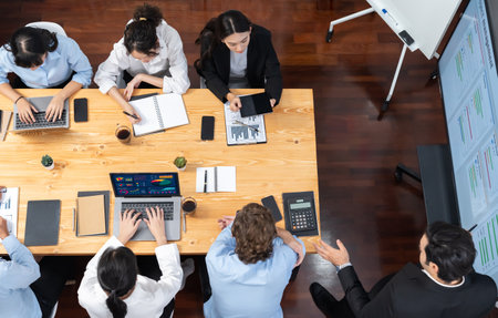 Panoramic top view project manager planning schedule for business task at meeting room, Gantt chart time line software show on TV. Multi ethnic business people and modern project management.Meticulousの写真素材