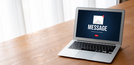 Email notification message showing on computer screen snugly. Digital marketing message information text from business to customer clientのeditorial素材