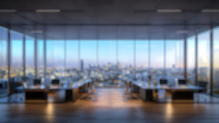 Blur background of window view of modern meeting room interior with skyscraper in urban city and blue sky. Conference room with window view of tower or building structure in city. Indoor.の写真素材