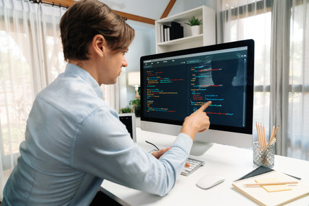 IT developer selecting by point on coding online software development information on pc comparing with laptop screen of new code programs update version firmware overall system project.の写真素材