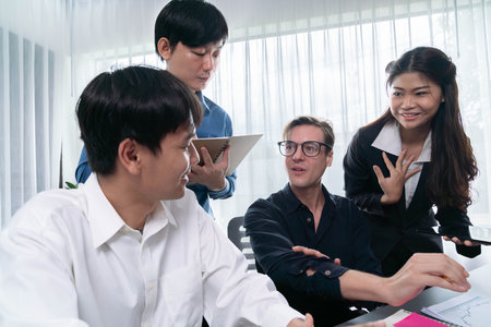 Group of diverse office worker employee working together on strategic business marketing planning in corporate office room. Positive teamwork in business workplace concept. Prudentの写真素材
