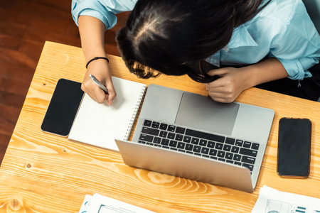 Top view diverse group of business analyst team analyzing financial data report paper on meeting table. Chart and graph dashboard by business intelligence analysis.の写真素材