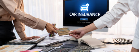 Group of interior architect designer team at table choosing various mood board samples with architecture software on laptop screen. Modern renovation and interior material selection concept.の写真素材