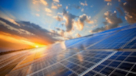 Blur background of solar station panel in the field with blue sky. Clean electrical energy. Ecology. Top view of solar panel absorb sunlight and generate electricity. Technology innovation. Spate.の写真素材