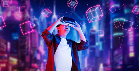 Smart man wearing VR glasses while excited about exploring in metaverse. Asian gamer looking at...
