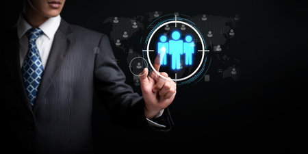 Business person analyzes data to identify customer target groups, refining marketing strategies. Tailoring messages to meet the specific needs of each target group.の写真素材