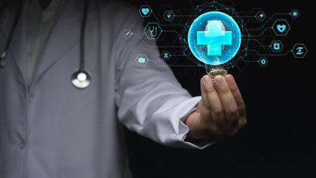 Close up of skilled doctor holding and picking light bulb with medical cross. Smart general practitioner accessing medical data and representing creative innovation of healthcare system. Remedial.の写真素材