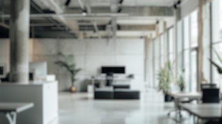 Blur background of spacious lobby with high ceilings and marble floors, adorned with indoor plants surrounded with skyscraper. Luxury architecture concept. Design for interior, wallpaper.の写真素材