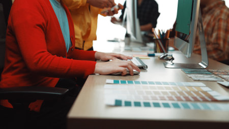 A vibrant design session in a modern workspace highlights creative professionals collaborating over...