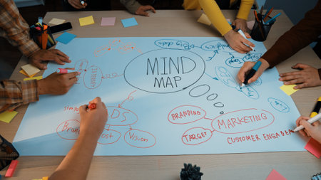 A dynamic scene showcasing a group of people collaborating on a mind map for strategic planning in a modern workspace, highlighting creativity and teamwork.の写真素材