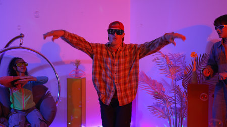 Happy hipster show break dancing while multicultural friend with casual cloth cheering at studio....
