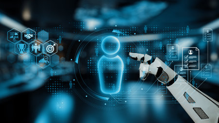 A futuristic robotic hand interacts with a glowing hologram of a human figure, symbolizing the...