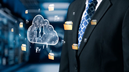 A businessman in a formal suit stands near a digital cloud storage concept, depicting the dynamics...