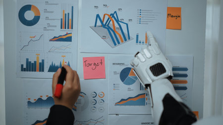 A robotic arm actively engages with business charts and graphs, showcasing a modern approach to data...