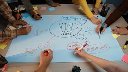 A vibrant workspace featuring a group of hands engaging in a brainstorming session around a large...