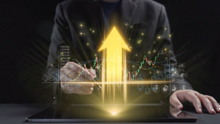 A business professional uses a tablet to analyze financial growth, featuring a glowing upward arrow...
