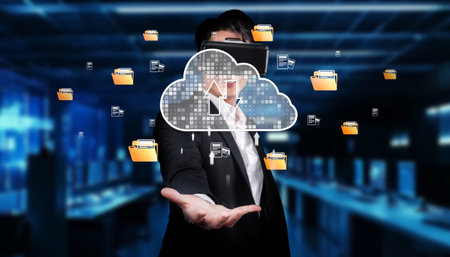 A business professional interacts with a virtual representation of cloud storage, showcasing modern data management and connectivity in a dynamic digital workspace environment.の写真素材