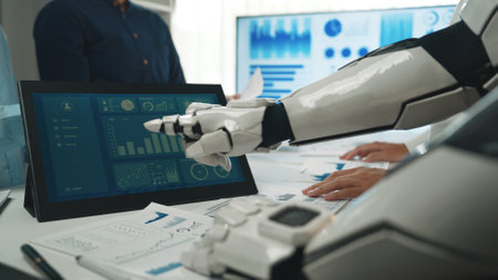 A robot collaborates with a human team in a modern office setting, analyzing data on a touchscreen...