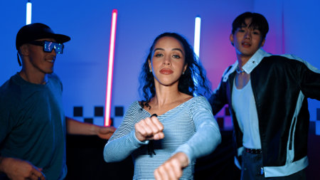 Diverse street dancer moving to city pop music at party with neon light while man wearing fancy...