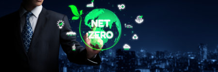 Digital globe with Net Zero surrounded by sustainability icons, representing the goal of reducing carbon emissions and achieving environmental balanceの写真素材