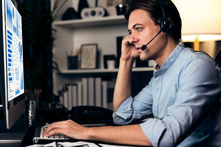Call center consulting with customers on headphones on monitor in business paragraph with typing on...