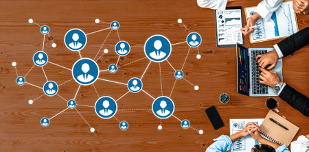 A dynamic overhead view of a networking concept showcasing a collaborative workspace with...