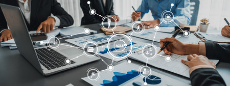 Business intelligence and data analysis concept. Team of analyst working on financial data analysis dashboard on paper as marketing indication for business strategic planning.の写真素材