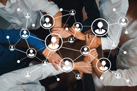 Engaging image showcasing the essence of networking among business professionals through hands-on collaboration and digital connectivity in a vibrant office environment.の写真素材