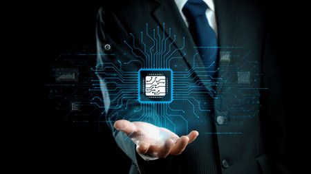 A professional businessman dressed in a suit holds a circuit board chip emitting digital connections, representing technology, innovation, and future trends in business.の写真素材