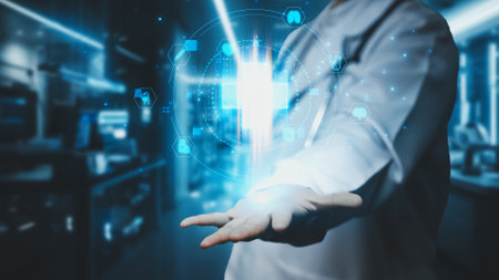 Close up of smart medical worker holding medical cross hologram at laboratory. Professional doctor checking and looking at medical data while standing and working at hospital. Technology. Remedial.の写真素材