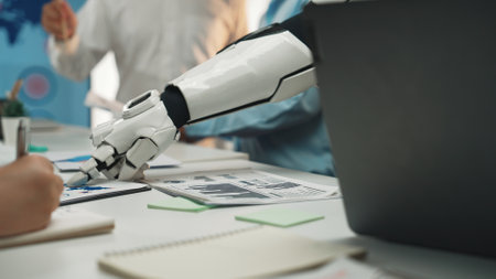 A robotic arm engages with business professionals in a modern office, highlighting teamwork and technology in project planning and collaboration.の写真素材