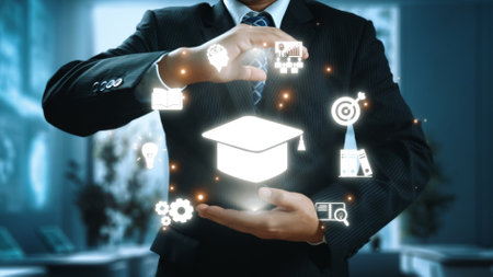 A businessman demonstrates a range of educational symbols and icons in a modern office environment, symbolizing innovation, learning, and professional development.の写真素材