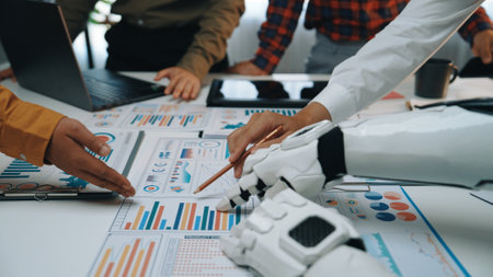 Teamwork in action as a robot hand assists in analyzing data reports. Modern office setting...