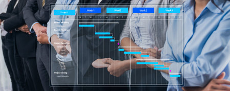 A Gantt chart highlights project management elements with business professionals working together,...