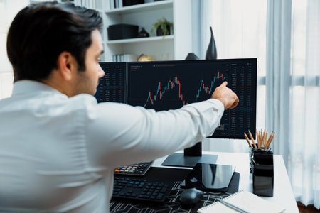 Trader businessman calling to consultant or partner with two stock exchange investment, compare data...