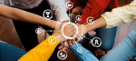 Startup company employee team stacking hand together symbolize successful group of business partnership and strong collective unity teamwork in community workplace in panoramic banner. Synergic Amityの写真素材