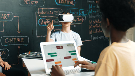 African boy programing system while caucasian girl enter metaverse while sitting at blackboard with engineering code written.Highschool girl wearing VR or headset in STEM technology. Edification.の写真素材