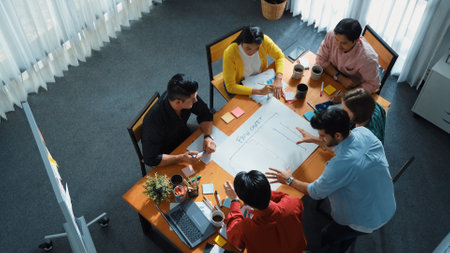 Top down view of diverse people brainstorming and making scrum task board. Group of skilled business...