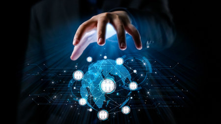 A close-up view of a hand reaching out toward a glowing digital network over a globe, symbolizing technological advancement and global communication in a modern business landscape.の写真素材